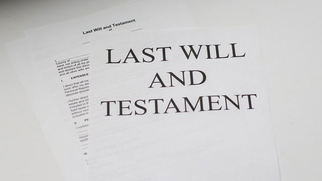 papers with Last Will and Testament written on it